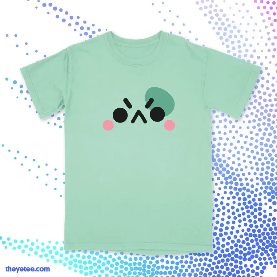 Light green cozy gamer T-shirt featuring a cute kawaii face with blush cheeks, perfect for gaming an.