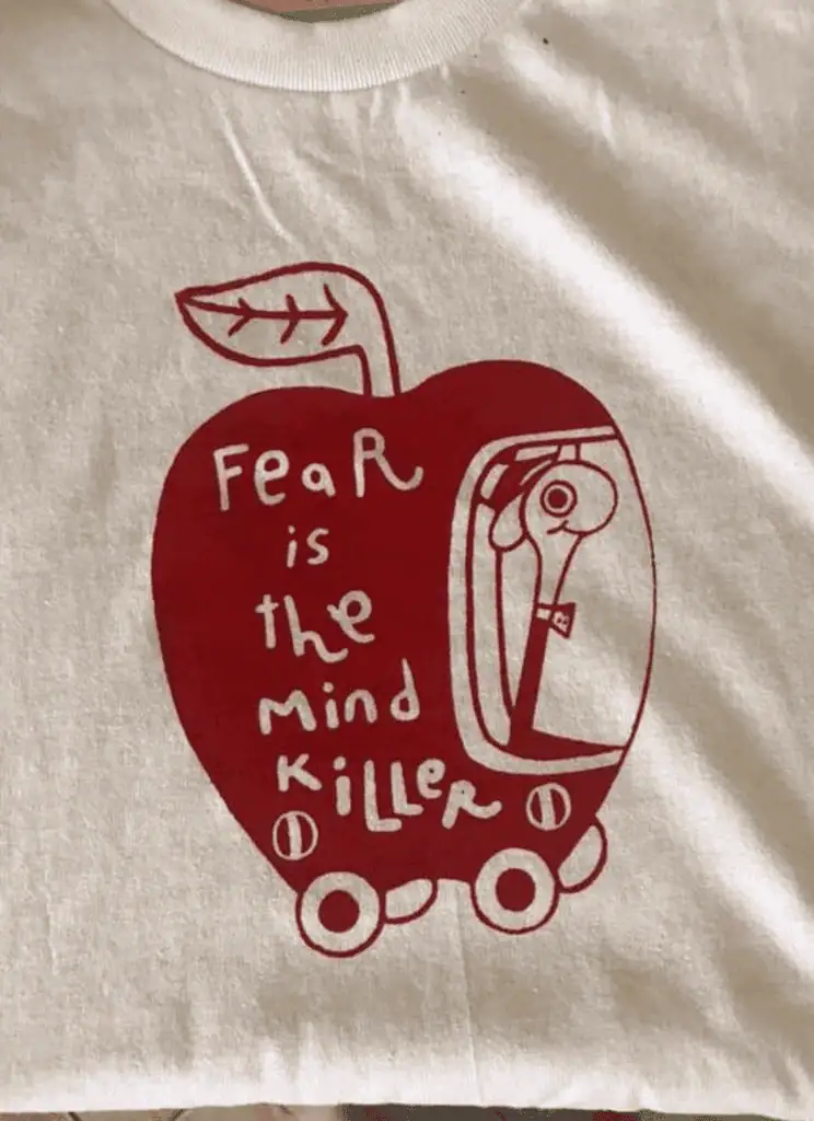 Fear is the mind killer illustration with a stylized apple and skateboard design.